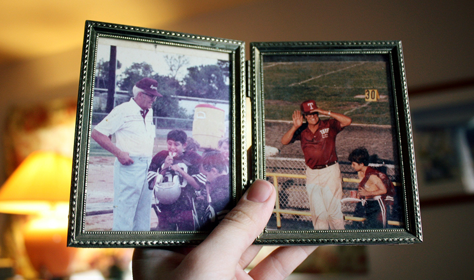 Hand holding small picture frames